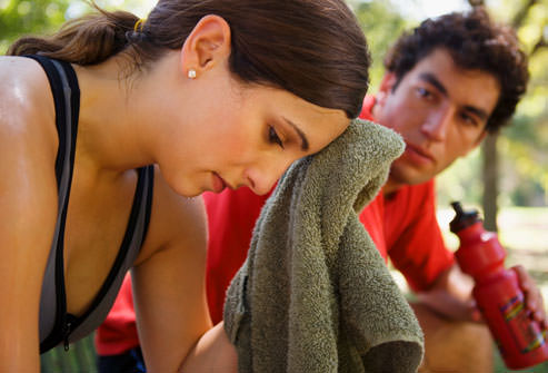 Woman athlete with fascial movement tape