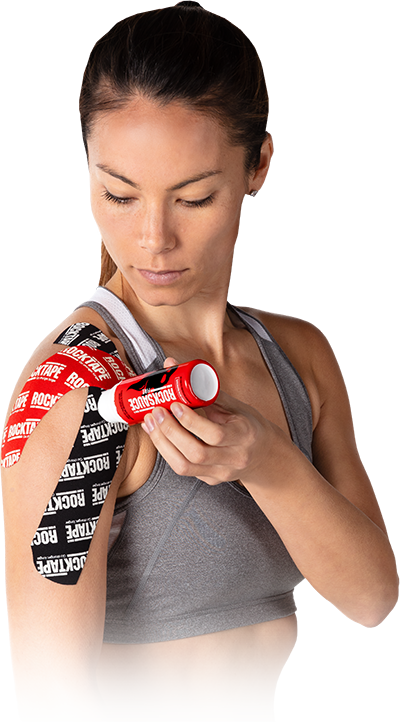 Woman applying Rock Tape in Stockton, CA