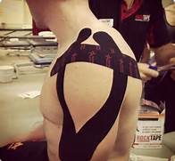 Woman athlete with fascial movement tape